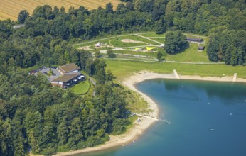 Aerial view, H1 am See Restaurant with green roof, sandy beach and adventure playground Piraten
