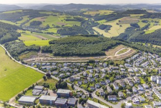 Aerial view, construction site, construction road An der Sündelt for planned new development area,