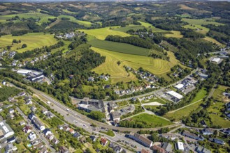 Aerial view, railway station with platform and bus station ZOB, VolmeFreizeitPark, hilly landscape