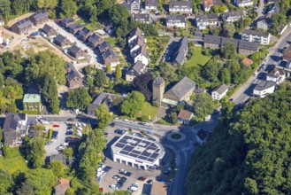 Aerial view, residential area at St Joseph's Church, Ford Kneifel car dealership with solar roof,