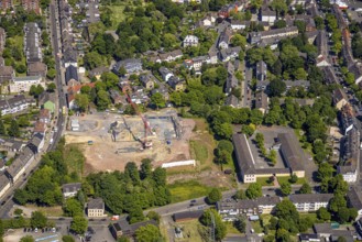 Aerial view, construction site and construction crane for residential complex Quartier der