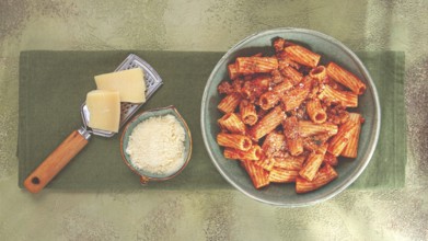 Rigatoni pasta, with meat sauce, and parmesan cheese, top view, homemade, no people