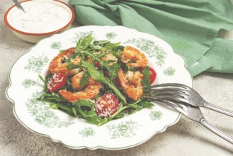 Shrimp salad with arugula and cherry tomatoes, with parmesan cheese, healthy food