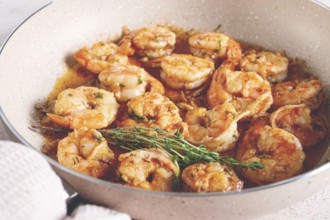 Shrimp dish cooked, in savory sauce. with fragrant herbs, and spices