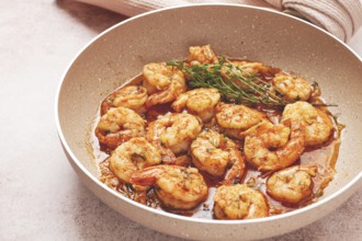 Shrimp dish cooked, in savory sauce. with fragrant herbs, and spices
