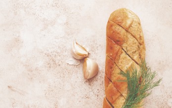 Freshly baked garlic bread with herbs and garlic on a light countertop