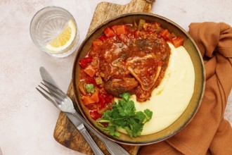 Ossobuco, stewed meat knuckle on the bone, with mashed potatoes, and oats and spices, homemade, no