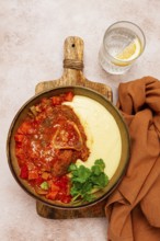 Ossobuco, stewed meat knuckle on the bone, with mashed potatoes, and oats and spices, homemade, no