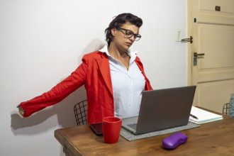 Professional woman taking a much-needed stretching break from work