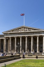 London, United Kingdom - 14 May 2025: Tourists gathering on the steps of the famous British Museum
