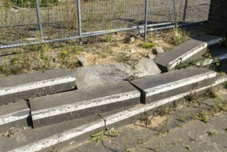 Concrete barricades with white stripes on pavement, Manheim, North Rhine-Westphalia, Germany