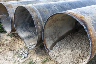 Cut open pipes with concrete residue, Manheim, North Rhine-Westphalia, Germany