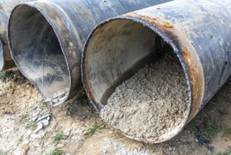 Cut open pipes with concrete residue, Manheim, North Rhine-Westphalia, Germany