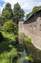 Brick façade of Paffendorf Castle with moat, Paffendorf, North Rhine-Westphalia, Germany