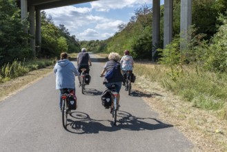Cyclist on new track at Hambach open-cast mine, Hambach, Rhineland-Palatinate, Germany