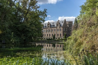 Castle on the water with reflection, Paffendorf, North Rhine-Westphalia, Germany