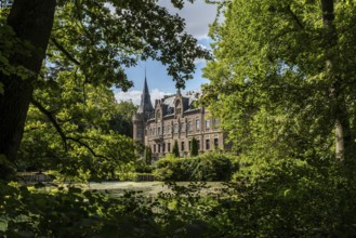 Castle framed by trees, Paffendorf, North Rhine-Westphalia, Germany