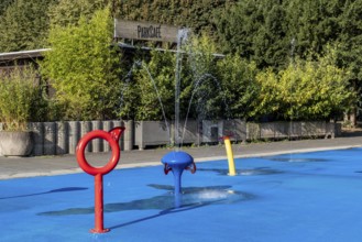 Water playground with red ring and fountain, Cologne green belt, North Rhine-Westphalia
