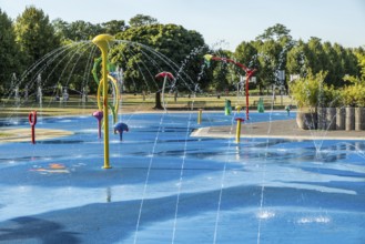 Water playground with colourful fountains at a glance, green belt, Cologne, North Rhine-Westphalia