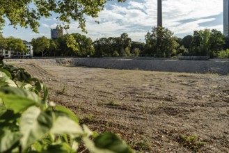 Excavation pit on Innere Kanalstraße with vegetation, Cologne, North Rhine-Westphalia, Germany