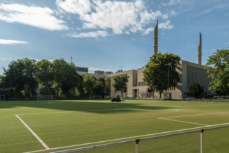 Football pitch with mosque in the background