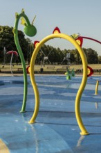 Water playground with large yellow arch, green belt, Cologne, North Rhine-Westphalia