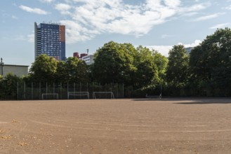 Football pitch with tower block in the background