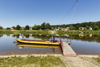 Cyclist on yaw rope ferry, passenger ferry on the Weser, from Herstelle to Würgassen, Beverungen,
