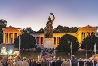 Ruhmeshalle, Bavaria statue and visitors at the Oktoberfest 2024 at dusk, Munich, Bavaria, Germany