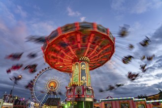 Chain carousel at Oktoberfest 2024 at dusk, Munich, Bavaria, Germany