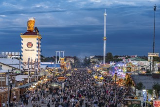 Visitors at the Oktoberfest 2024 seen from above at dusk, Munich, Bavaria, Germany