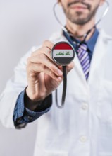 Iraq health and medical insurance concept. Iraq healthcare system, doctor holding stethoscope
