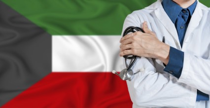 Doctor with stethoscope on Kuwait flag. Doctor holding stethoscope on Kuwait flag