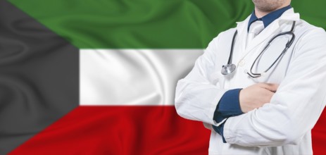 Kuwait healthcare concept. Male doctor on Kuwait flag. Doctor with crossed arms on Kuwait flag