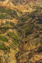 Mountain landscape, snowfields, river, valley, sunny, summer, volcanic landscape, aerial view,