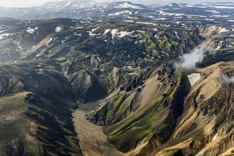 Mountain landscape, sunny, summer, river, snowfields, volcanic landscape, aerial view,