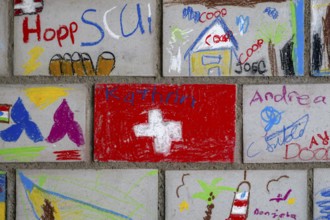 Brick wall painted by schoolchildren, Interlaken, Switzerland