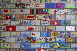 Brick wall painted by schoolchildren, Interlaken, Switzerland