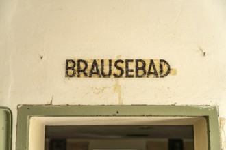 Shower bath inscription on a gas chamber, Dachau Concentration Camp Memorial, Bavaria, Germany