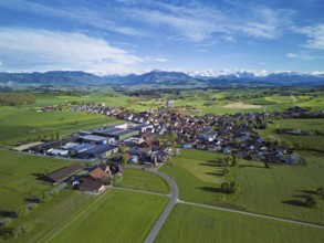 View of the village, in the foreground the industrial area, in the background the Rigi and the