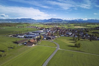 View of the village, in the foreground the industrial area, in the background the Rigi and the