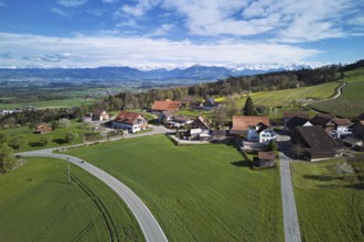 View of the hamlet of Brunnwil, behind the Rigi and the snow-covered Alps, Beinwil, Freiamt,