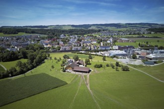 View of the village with the catholic parish church Mariä Geburt, on the right the industrial area,