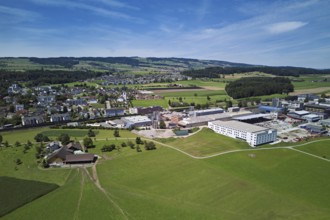 View of the village with the catholic parish church Mariä Geburt, on the right the industrial area,