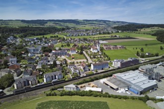 View of the village with the catholic parish church Mariä Geburt, on the right the industrial area,