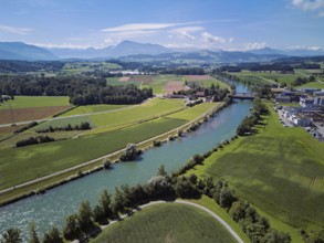 River Reuss, on the right the industrial area, behind the old wooden bridge and the Pilatus, Sins,