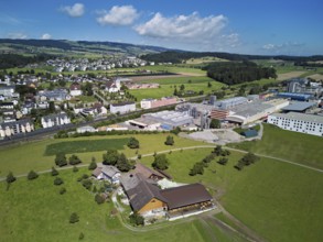 View of the village with the catholic parish church Mariä Geburt, on the right the industrial area,