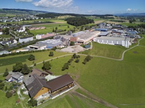 View of the village with the catholic parish church Mariä Geburt, on the right the industrial area,