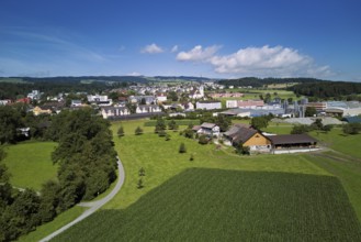 View of the village with the catholic parish church Mariä Geburt, on the right the industrial area,