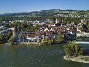 Old town with the Catholic Church of St Nicholas and the witches' tower, in the foreground the weir